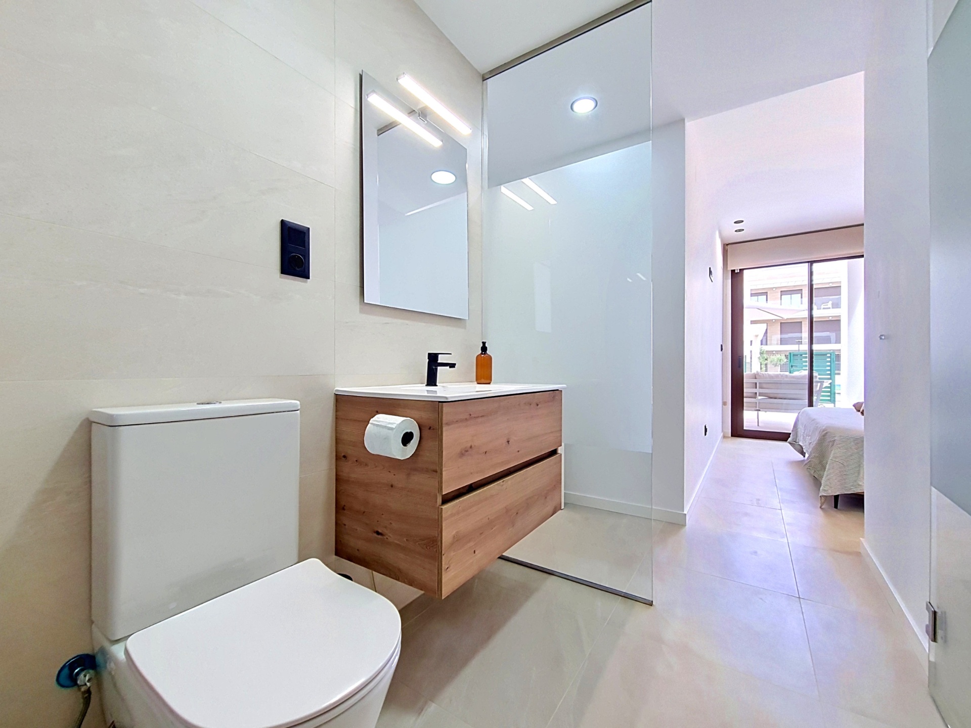 Bathroom view from the vanity towards the adjoining bedroom