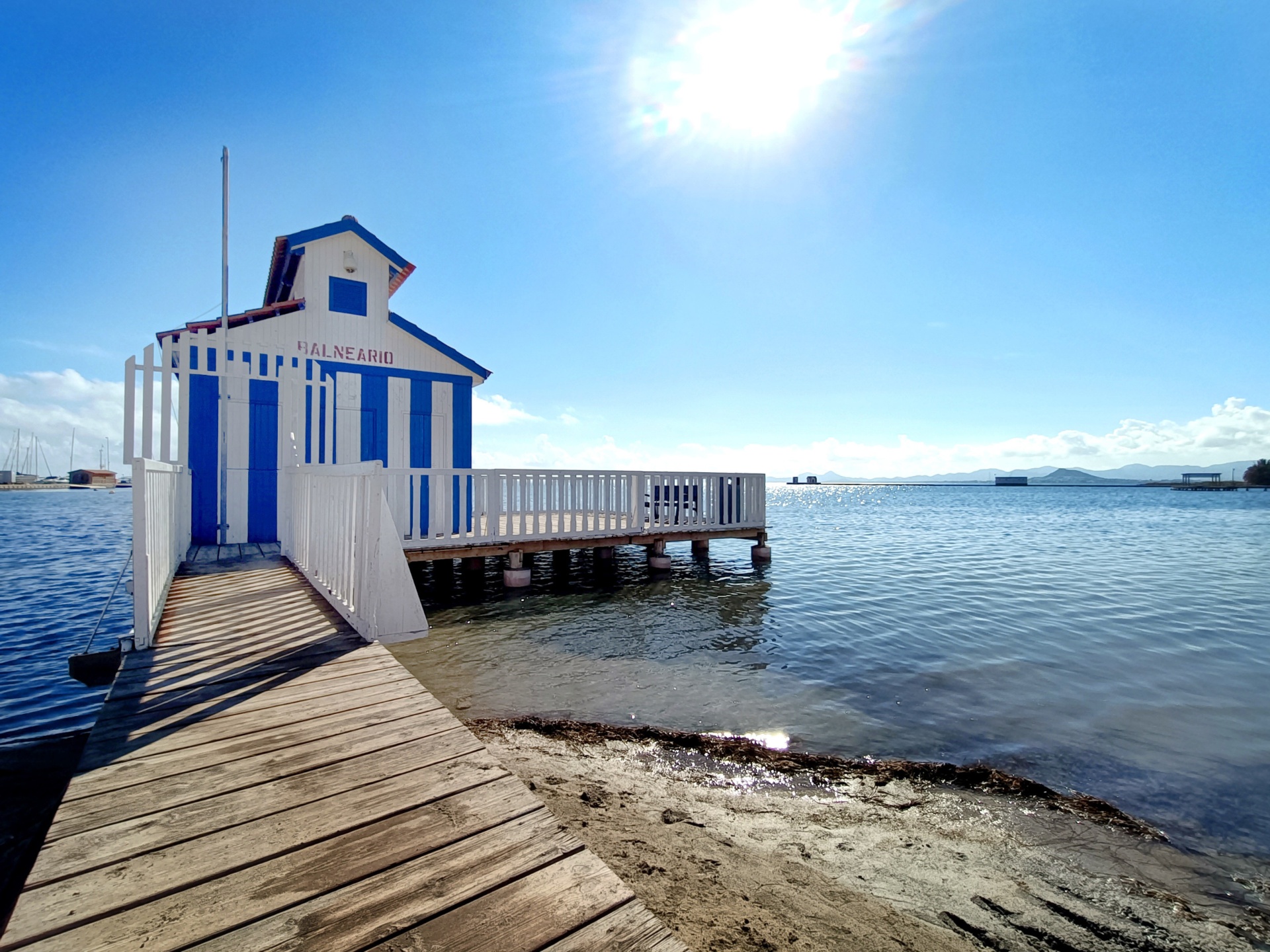 Blue-and-white bathhouse on the Mar Menor shoreline
