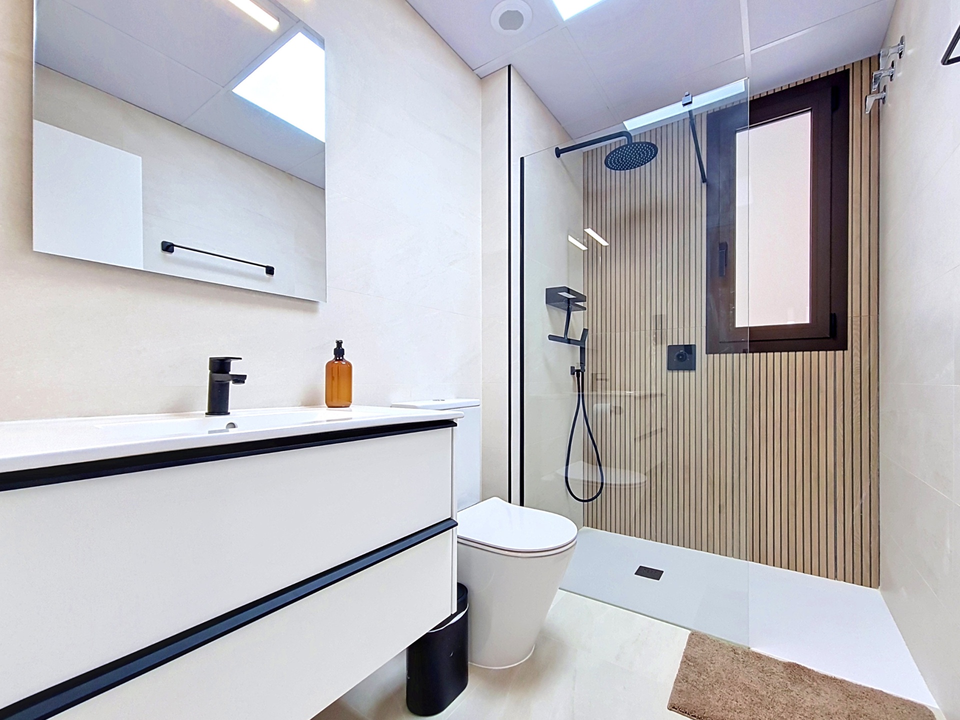 Second bathroom with walk-in shower and black fittings