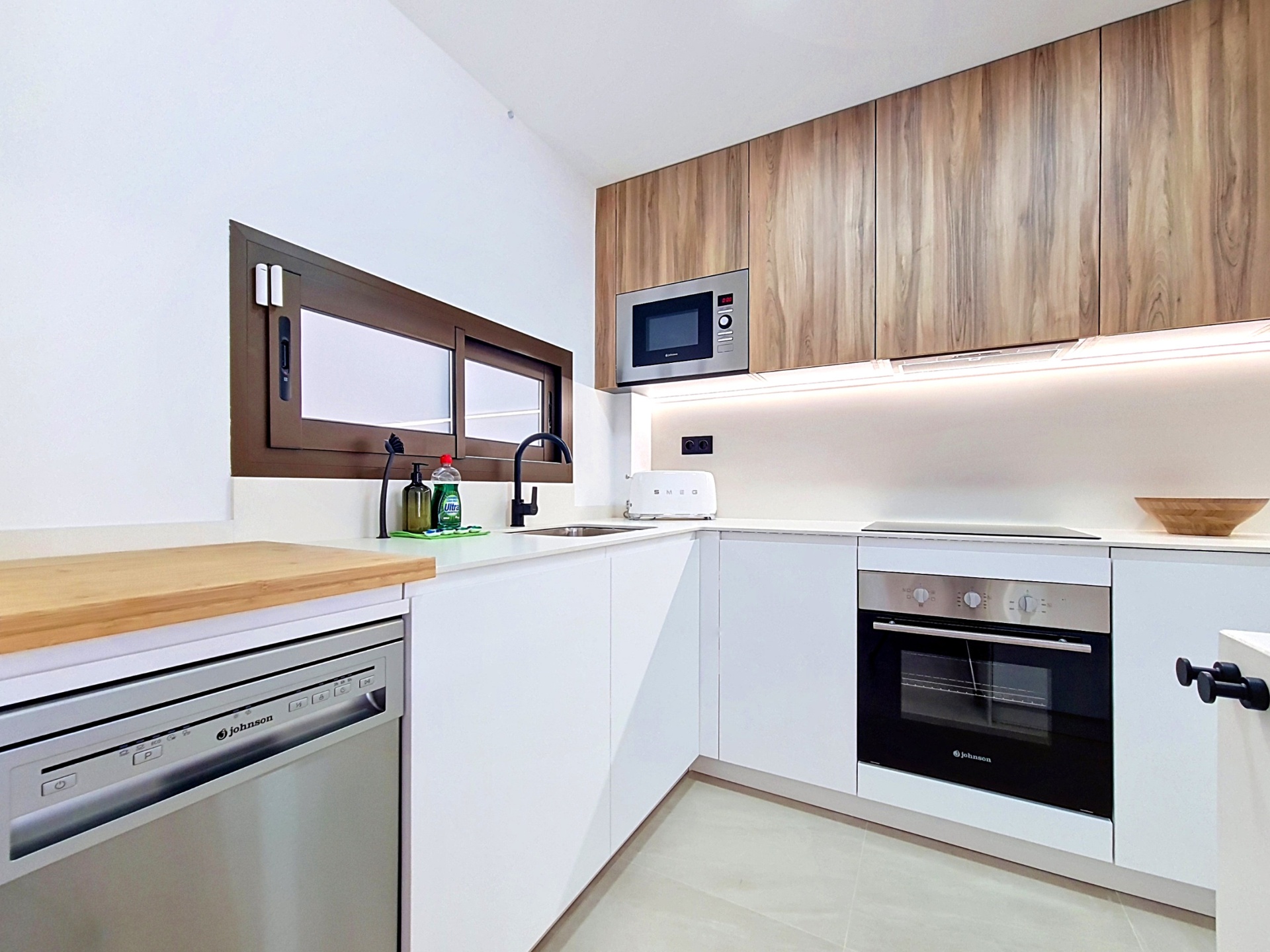 Kitchen with dishwasher, induction hob and microwave