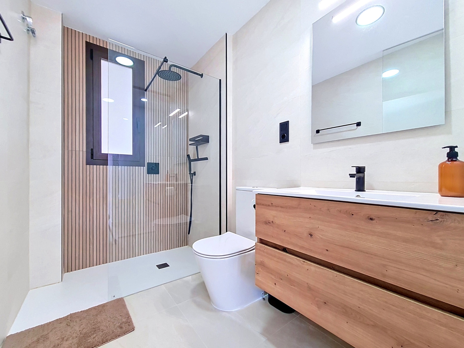 En-suite bathroom with walk-in shower and vanity unit