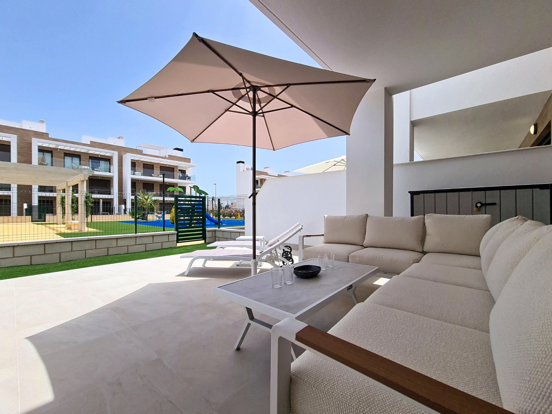 Terrace lounge area overlooking the playground and pool area