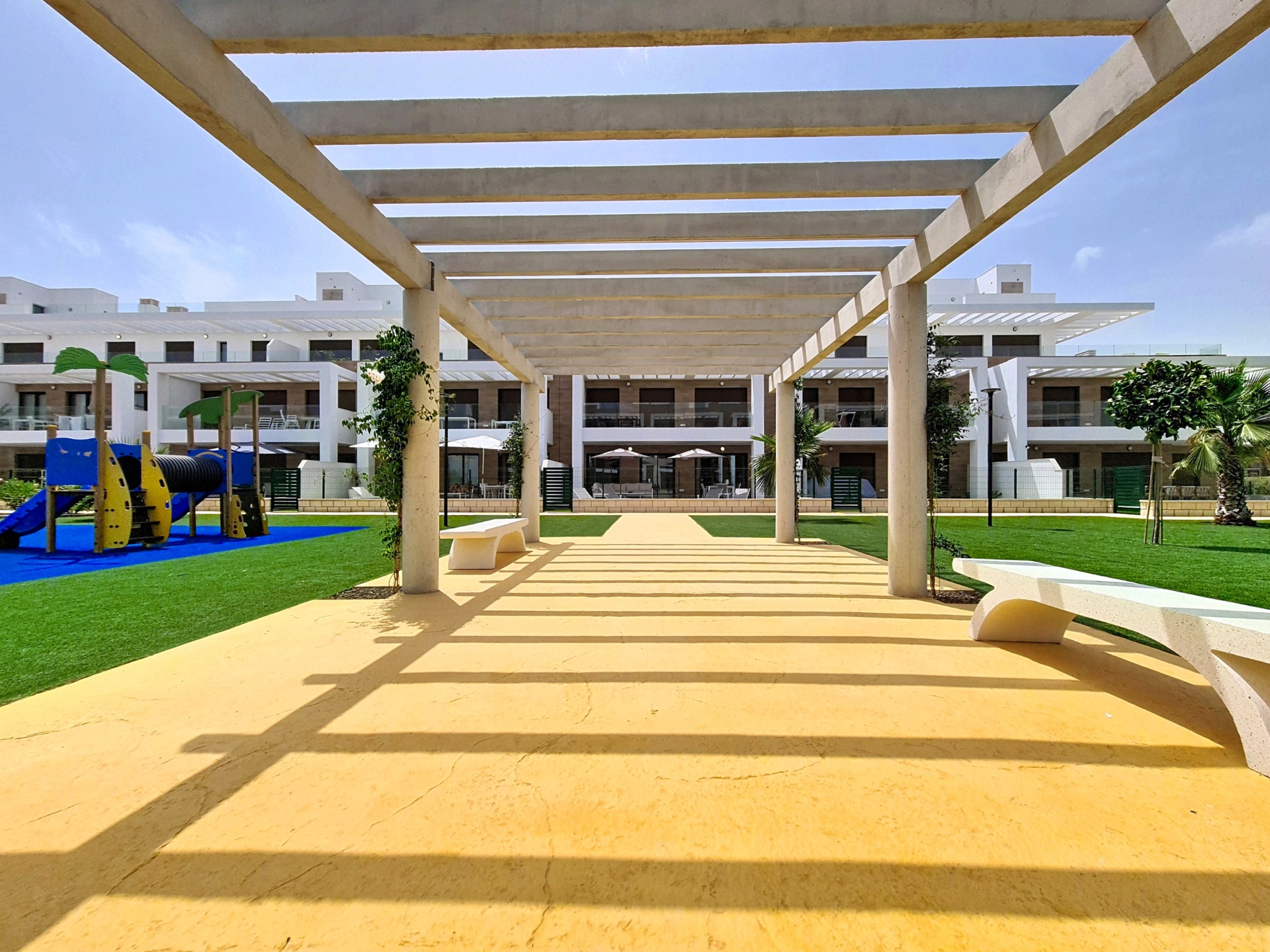 Pergola walkway and landscaped central garden
