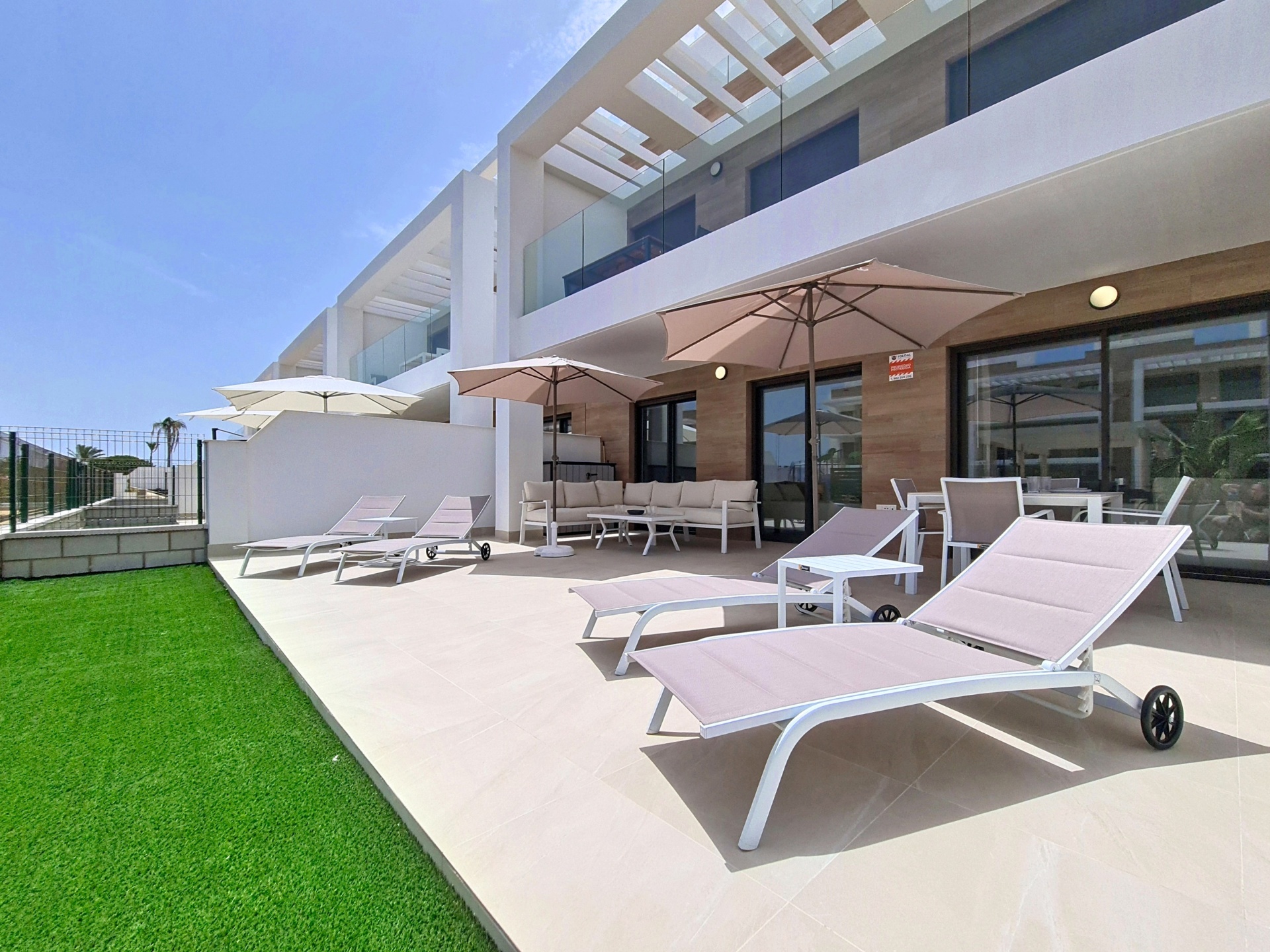 Wide view of the private terrace and apartment frontage