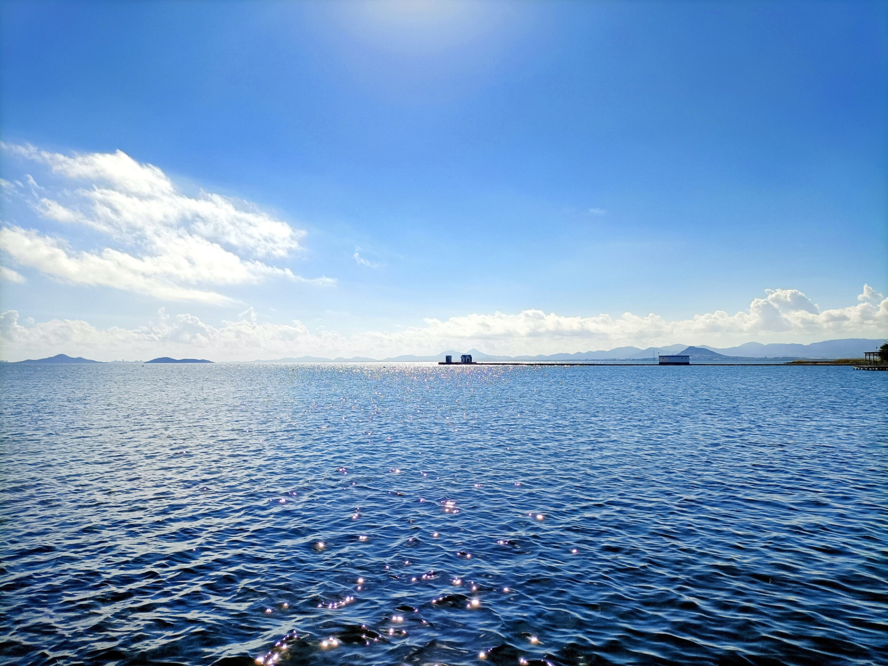Sunlit view across the calm waters of the Mar Menor