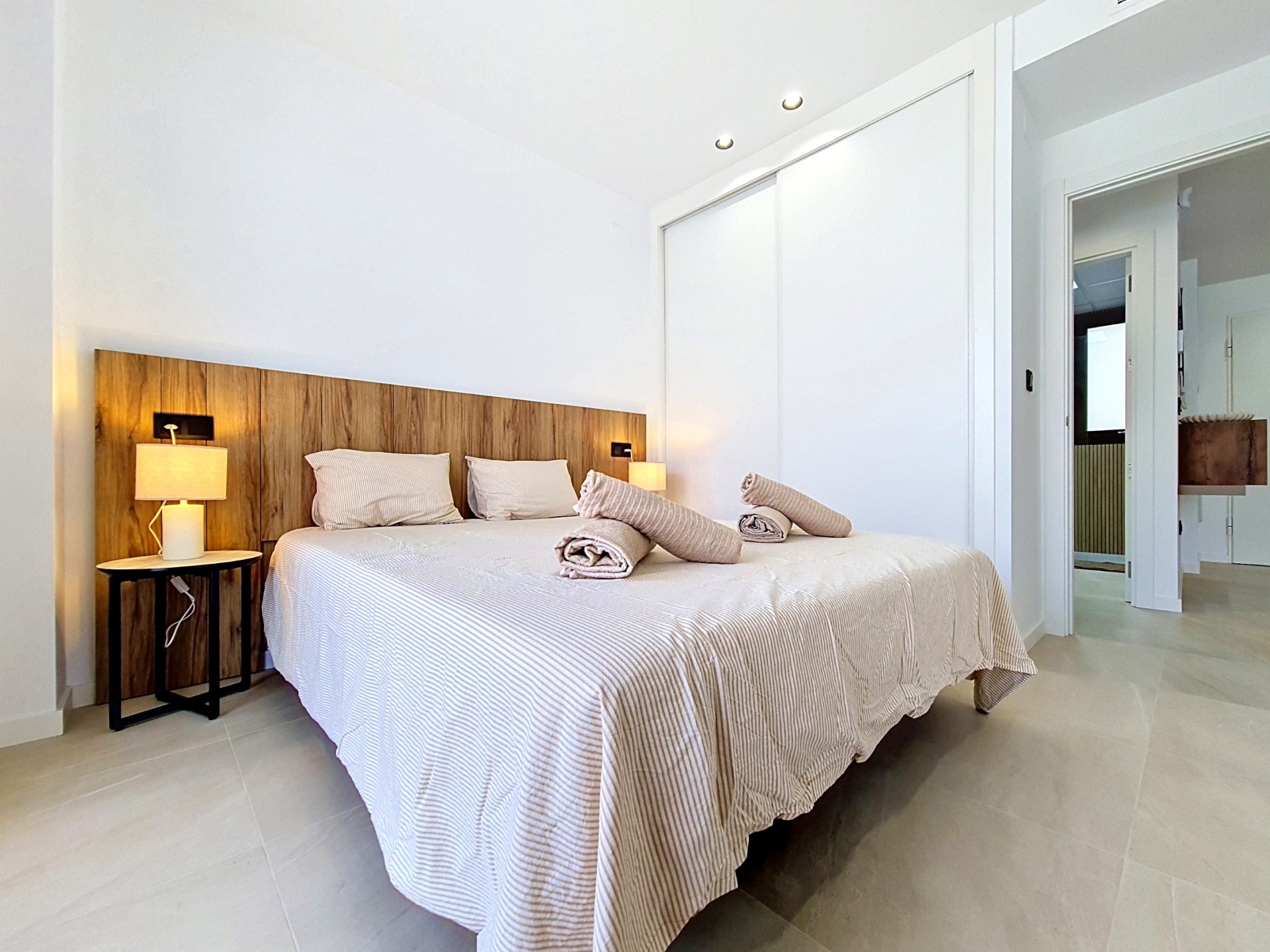 Second bedroom with wardrobes and hallway access