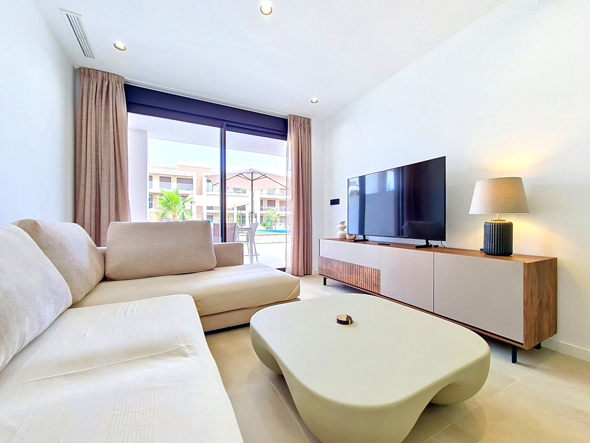 Living room view towards the terrace and pool area